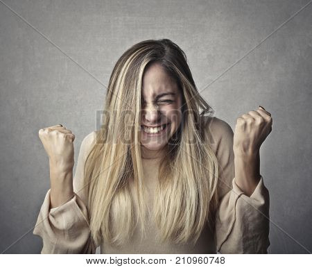 Successful girl exulting
