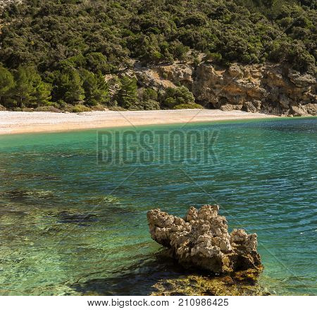 Bay near Lubenice (Cres Croatia) with rock in foreground on a sunny day in spring