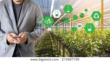 Agriculture Technology Concept Man Agronomist Using A Tablet Internet Of Things  Report