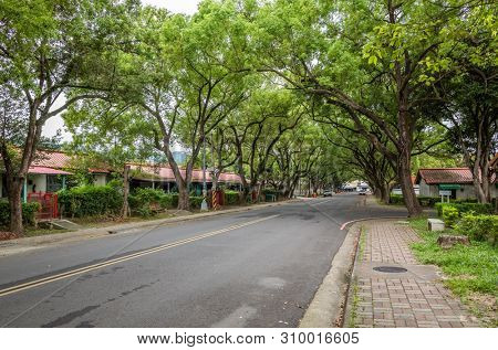 Nantou, Taiwan - June 25th, 2019: street scenery with old house and trees at Zhongxing New Village, Nantou, Taiwan