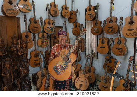 Gianyar,bali/indonesia-may 30 2019: I Wayan Tuges, The Owner Of The Tuges And Blueberry Carving Guit