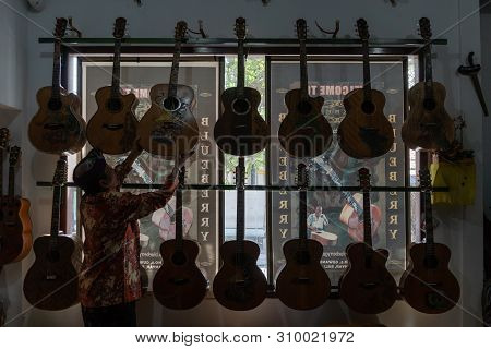 Gianyar,bali/indonesia-may 30 2019: I Wayan Tuges, The Owner Of The Tuges And Blueberry Carving Guit