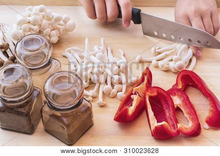 White Small Mushrooms . Small White And Brown Mushrooms On The Table.white Beech Mushrooms Or Shimej