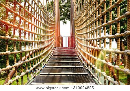 Wooden Bridge With Strong Robe At Playground Perspective