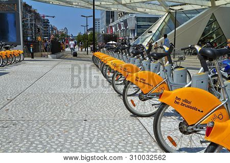 Brussels, Belgium - July 25, 2018. Villo Bicycles Parked In The Bicycle Sharing Station On Street. P