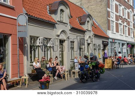 People Drinking On A Street Bar Of Aarhus On Denmark