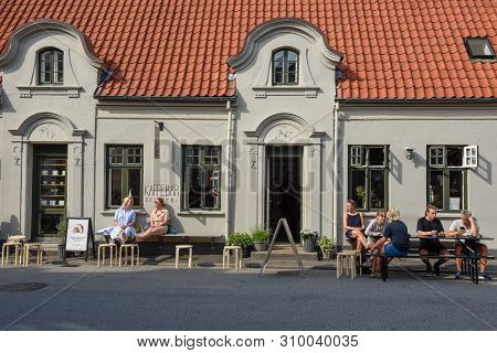 People Drinking On A Street Bar Of Aarhus On Denmark