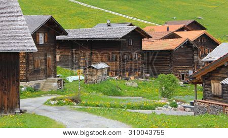 Old Timber Chalets In Obermutten, Switzerland. Canton Of Grisons.