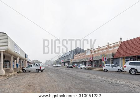 Standerton, South Africa - May 2, 2019: A Street Scene, With Businesses And Vehicles, In Standerton,