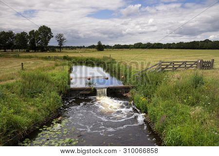 Weir In The River Ruiten Aa Near The Dutch Village Sellingen In The Province Groningen