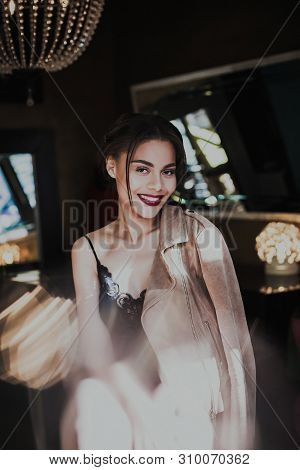 Young Beautiful Woman Mixed Race Posing In Seductive Lingerie And Suede Jacket. Fashion Photoshoot.