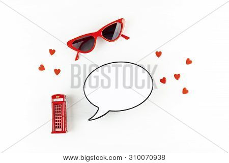 Flat Lay With London Phonebooth And Light Box In Form Of Speech Bubble With Copy Space For Text. Tra