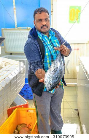 Al Khor, Qatar - February 23, 2019: Vendor Show To Big Fresh Fish To Shop Inside At Al Khor Fish Mar
