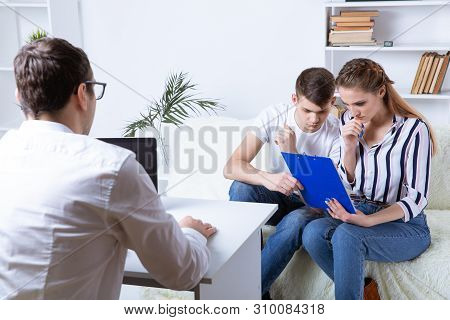 Young Couple Making Decition To Buy A House And Thinking About Mortgage.
