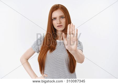 Wait Sec Hold On. Perplexed Displeased Angry Redhead Serious-looking Girl Raising Palm Stop Prohibit