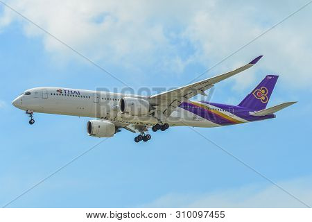 Airplane Landing At Singapore Airport