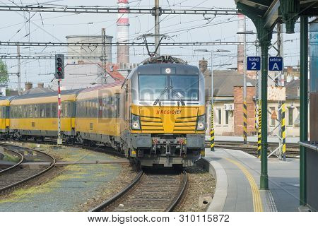 Brno, Czech Republic - April 24, 2018: The Yellow Passenger Train Of The Regiojet Company Arrives To