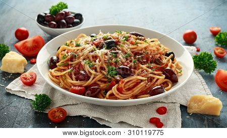Pasta Alla Puttanesca With Garlic, Olives, Capers, Tomato And Anchois Fish
