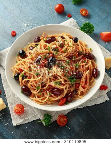 Pasta Alla Puttanesca With Garlic, Olives, Capers, Tomato And Anchois Fish