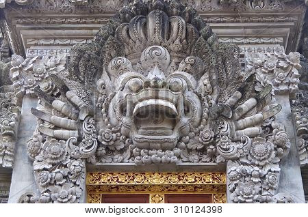 Close Up Picture Of A Typical Balinese Stone Mask Sculpture That Can Be Found At The Most Temples Ar