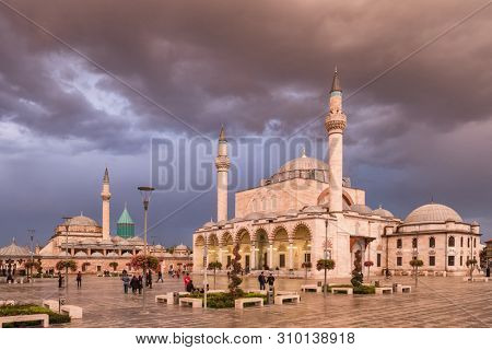 Konya, Turkey - October 20, 2018: The central square of the old town of Konya with the Mevlana Museum on the background and Selimiye Mosque, Turkey