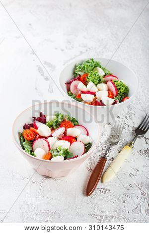 Salad From Iceberg Lettuce, Kale And Radiccio, Cherry Tomatoes, Radish, Mini Mozzarella And Pumpkin 