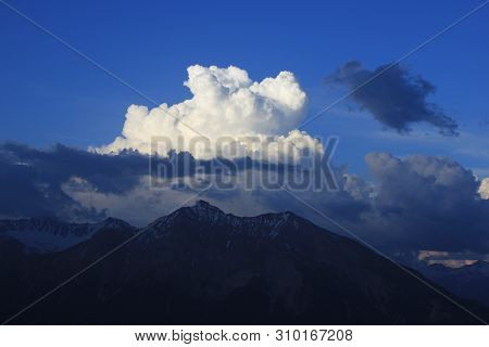 Cumulus Cloud Over Mount Lenzer Horn, Switzerland