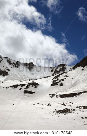 Sunlit Mountain Pass With Snow Cornice And Blue Cloudy Sky At Winter Evening. Turkey, Kachkar Mounta