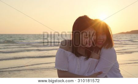 Young Asian Lesbian Couple Kissing Near Beach. Beautiful Women Lgbt Couple Happy Relax Enjoy Love An