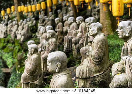 groups of buddhist arhat stone statue in the garden