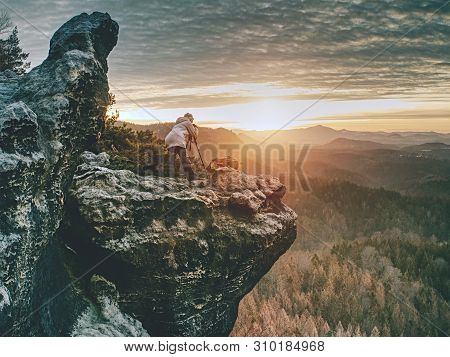 Hiker Woman Photographer Takes Impresive Photos From Sharp Cliff Edge.