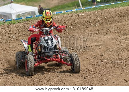 Brezova Nad Svitavou, Czech Republic - June 15, 2019: Young Rider In Red On A Bike Is A Passing Turn