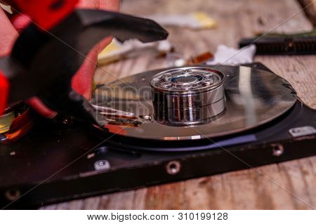 A Man Breaks A Computer Using Locksmith Tools. The Concept Of Hacking, Computer Hacking And Inept Co