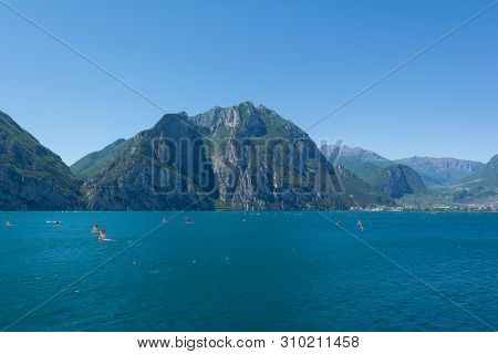 View Of Riva Del Garda Lakeshore With Lots Of Windsurfers On The Foreground Italy, Europe