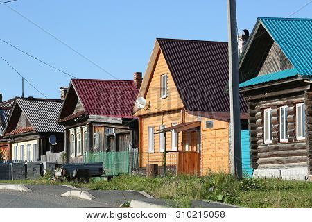 Russian Village In Summer, View Of The Village Street With Old And New Traditional Wooden Houses. Vi