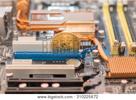 Bitcoin Cryptocurrency On The Computer Motherboard. Btc Cryptomoney