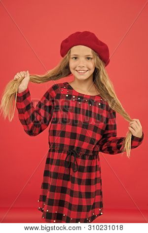Kid Little Cute Girl With Long Hair Posing In Hat Red Background. How To Wear French Beret. Beret St