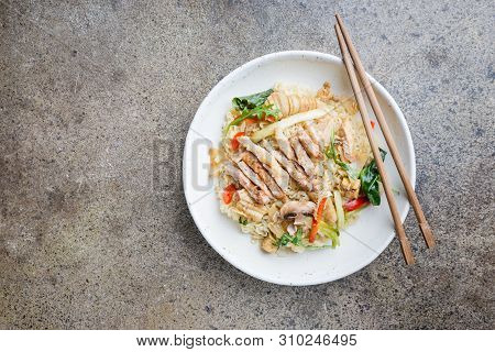 Japanese Ramen Noodle With Chicken, Shiitake Mushroms And Egg In White Bowl, Top View