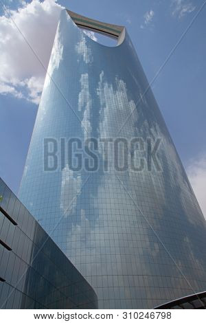 RIYADH - AUGUST 22: Sunset light at Al Faisaliah tower facade on August 22, 2016 in Riyadh, Saudi Arabia. Al Faisaliah towers is a luxury hotel and the most distinctive skyscraper in Saudi Arabia