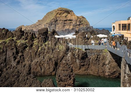 Porto Moniz, Madeira, Portugal - April 18, 2018: Natural Rock Pool Of Porto Moniz On Madeira Island.