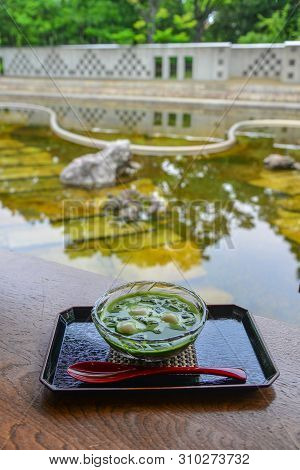Traditional Japanese Sweet Dessert With Zen Garden Background.