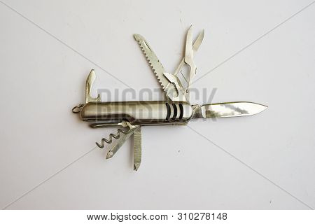 Small Pocket Penknife Of Stainless Steel On A White Background. Modern Folding Knife