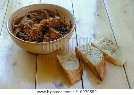 Traditional Polish bigos on the wooden table 