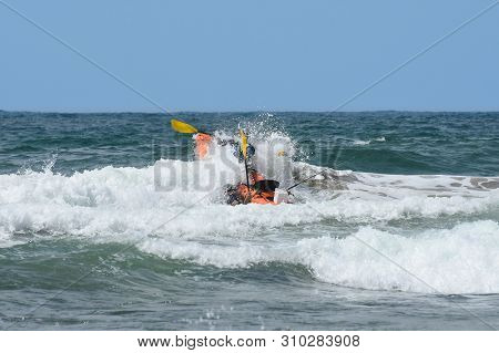 Ocean Kayak Crashing Through The Waves, Mossel Bay, South Africa