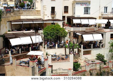 Ronda, Spain - May 5, 2008 - Tourists Relaxing At A Pavement Cafe Overlooking The Gorge, Ronda, Mala