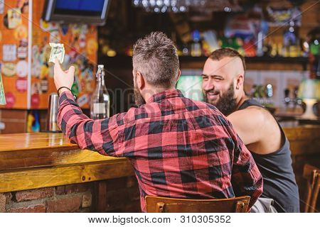 Friday Relaxation In Bar. Friends Relaxing In Pub. Hipster Brutal Bearded Man Spend Leisure With Fri