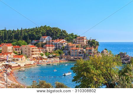 Picturesque Summer View Of Adriatic Sea Coast In Budva Riviera. Przno Village With Buildings On The 