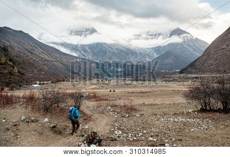 A Woman Trekker Heading To Samagau Valley On Manaslu Circuit With View Of Mount Manaslu Range 8 156 
