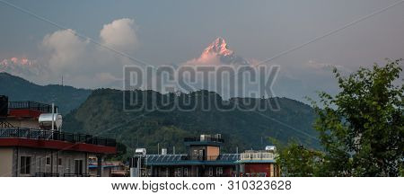 Landscape With Pokhara Rooftops On Sunrise With Annapurna South, Hiunchuli And Machapuchare Fishtail