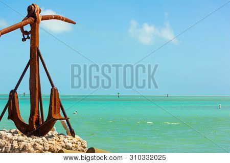 Big Rusty Anchor By The Sea In Florida Keys. Southern Florida, Usa